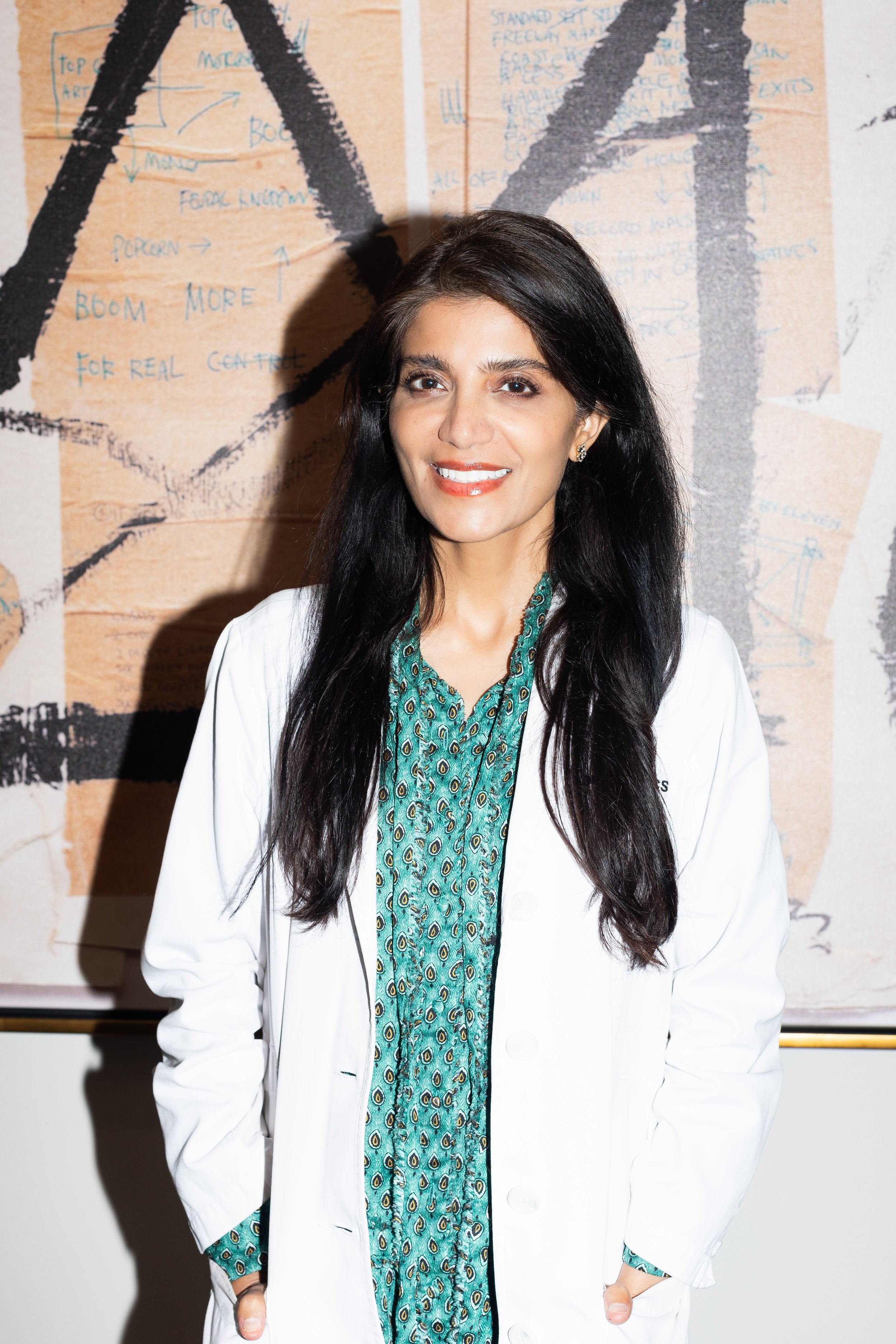 Dr. Lara Devgan in a white lab coat