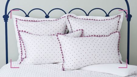 Bed with white pillowcases with purple polka dots with trim to support expert advice on how to remove yellow stains from pillows