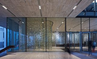 View from reception with metallic faux leather strips hanging from ceiling