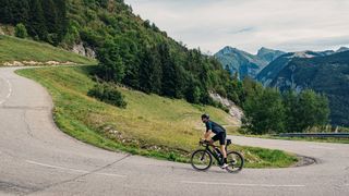 Cyclist on hairpin bend on Col de Corbier in France