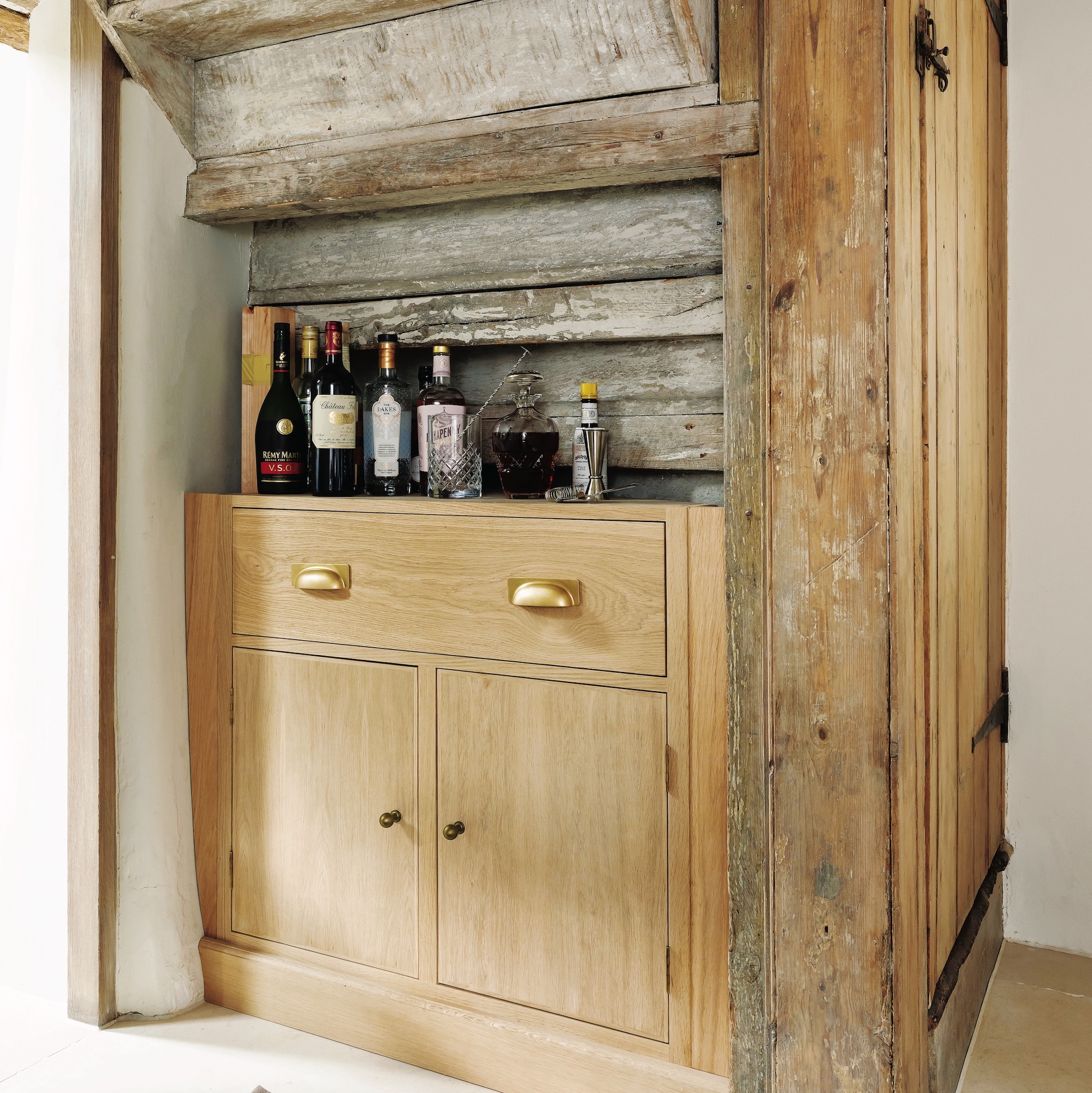 wooden cupboard wine storage under stairs