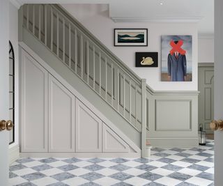 built in shaker style storage under stairs