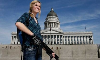 Darci Lund carries an AR-15 at a gun rights rally at the Utah State Capitol on March 2.