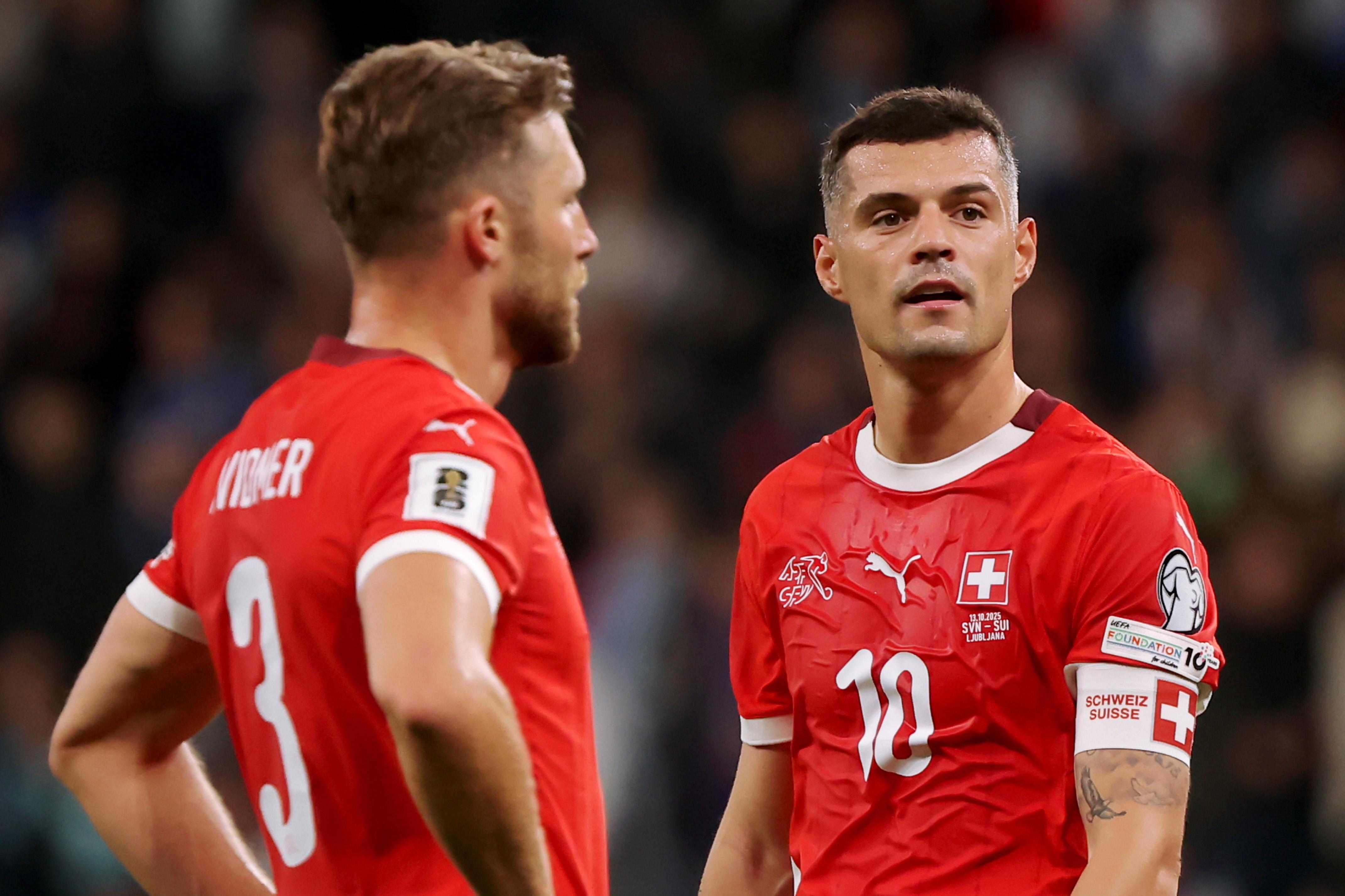 Switzerland captain Granit Xhaka alongside international team mate Silvan Widmer