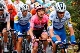 Team Deceuninck QuickStep rider Portugals Joao Almeida C wearing the overall leaders pink jersey rides during the 9th stage of the Giro dItalia 2020 cycling race a 207kilometer route between San Salvo and Roccaraso on October 11 2020 Photo by Luca Bettini AFP Photo by LUCA BETTINIAFP via Getty Images