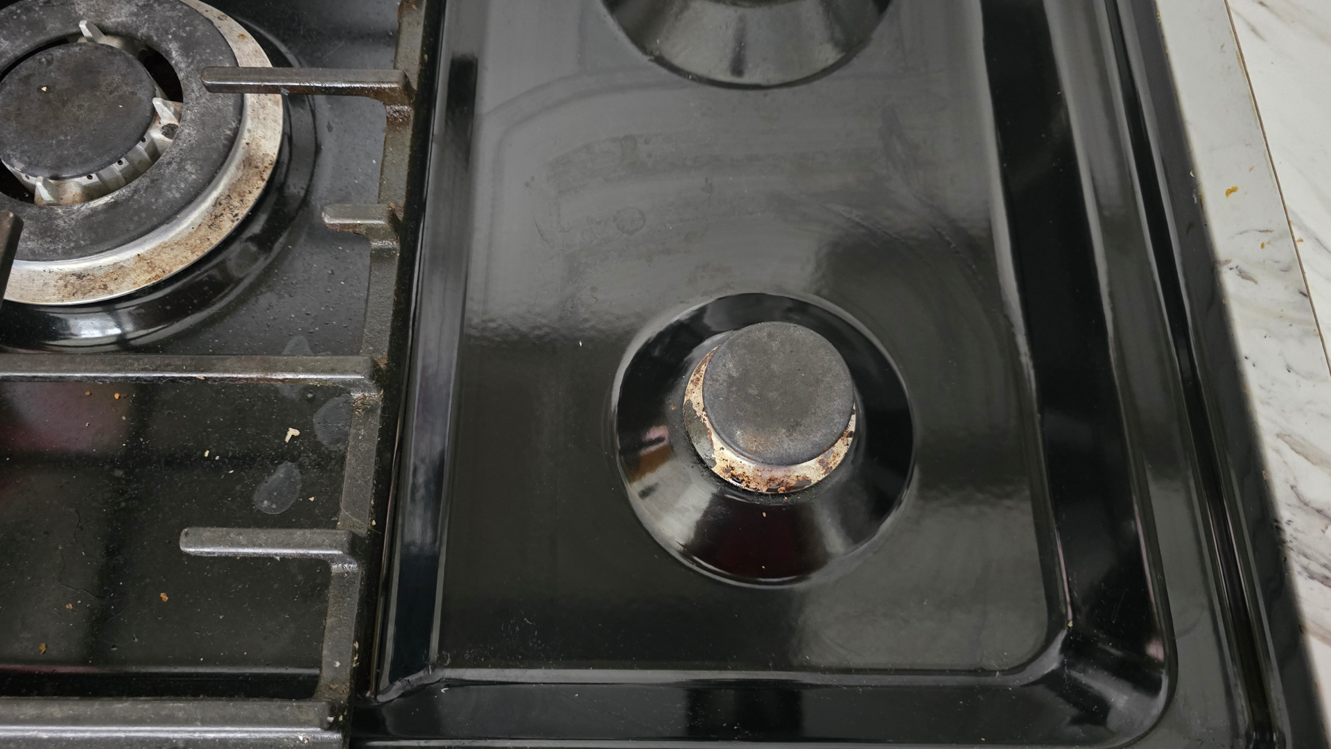 Black enamel hob after steam cleaning