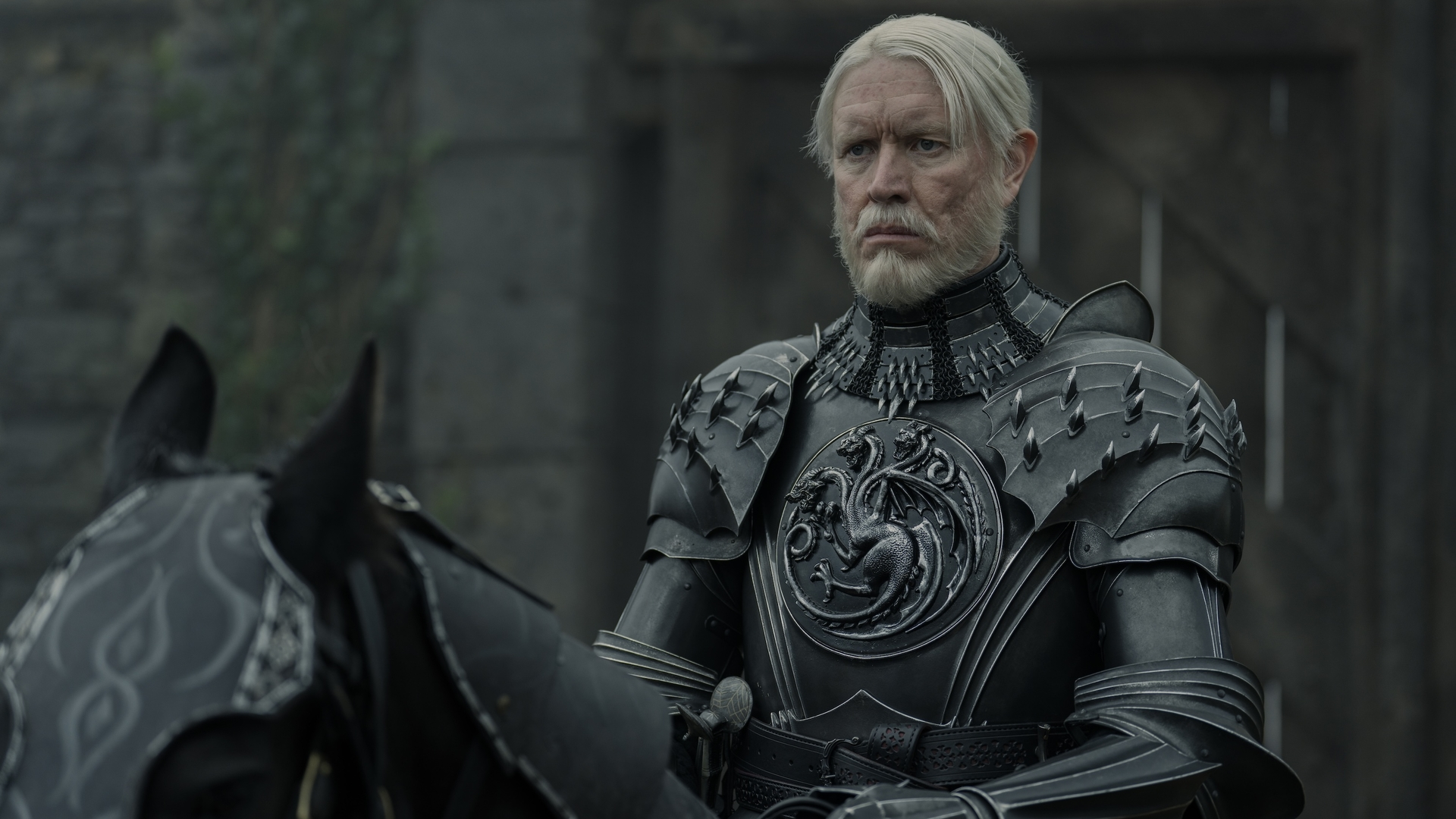 Prince Maekar Targaryen (Sam Spruell) in his House Targaryen armor astride a horse in a scene from "A Knight of the Seven Kingdoms" episode 5