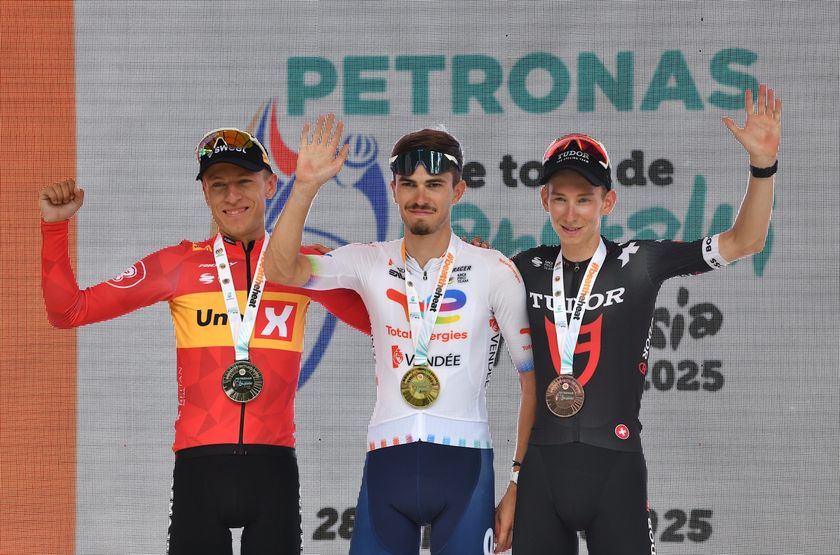 Stage 5 podium of Petronas Le Tour de Langkawi, with Joris Delbove (Total Energies) on the top spot but the riders either side, Anders Halland Johannessen (UNO-X Mobility) and Yannis Voisard (Tudor Pro Cycling) are not prepared to surrender the GC fight