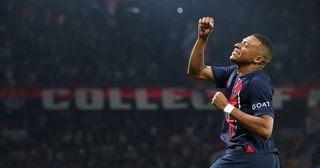 PSG star and Real Madrid target Kylian Mbappe punches the air as he celebrates scoring Paris Saint-Germain's third goal during the French L1 football match between Paris Saint-Germain (PSG) and RC Lens at the Parc des Princes Stadium in Paris on August 26, 2023.