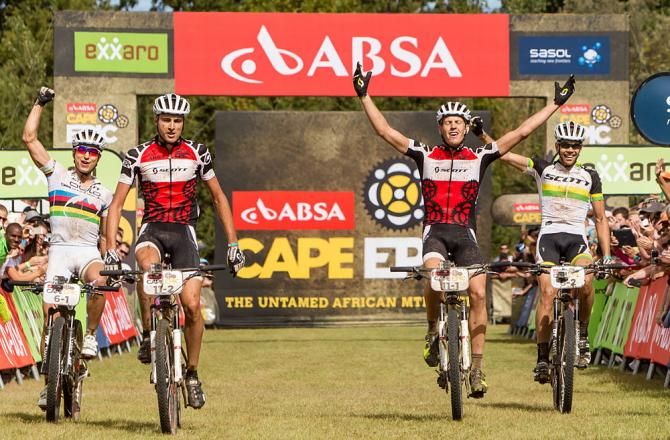 All African Jersey holders Gert Heyns (centre left) and Matthys Beukes (centre right) of SCOTT Factory Racing celebrate winning the final stage as Nino Schurter (far left) and Philip Buys (far right) of Scott-Odlo MTB Racing celebrate finishing second during the final stage
