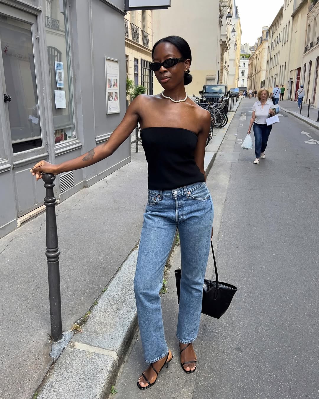 Sylvie in stovepipe jeans and sleeveless top