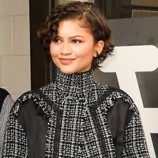 Zendaya left Good Morning America in a tweed jacket and a matching feather skirt