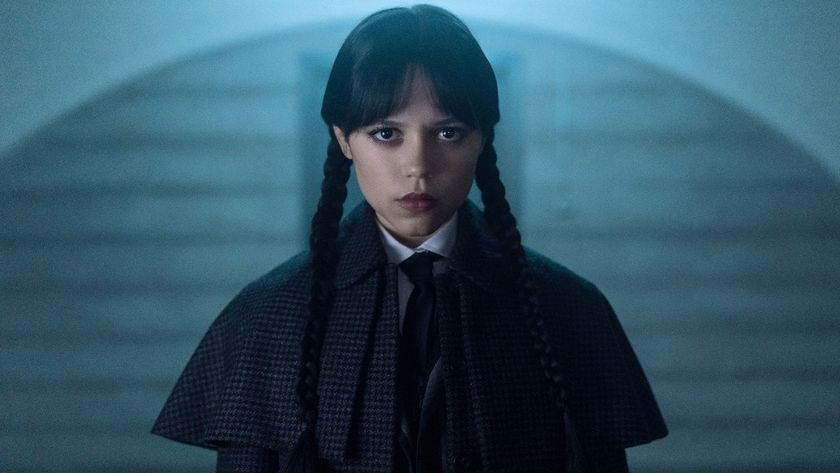 Jenna Ortega as Wednesday looking forward with a striaght face. 