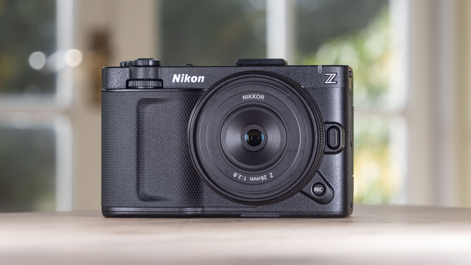 Nikon ZR product photos – camera on a wooden table