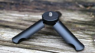 The mini tripod that comes with the PhotoGrip Qi 