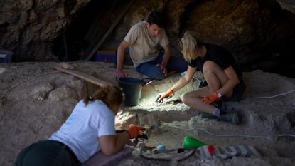 Archaeologists dig for ancient artifacts in Israel's Tinshemet Cave.