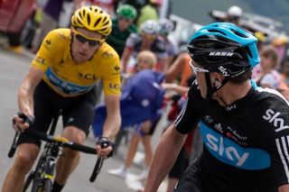 Second in the overall standings, Chris Froome looks back at overall leader and teammate Bradley Wiggins as they ride in the 17th stage of the 2012 Tour de France