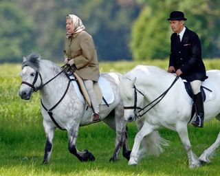 Queen Elizabeth and Terry Pendry riding horses