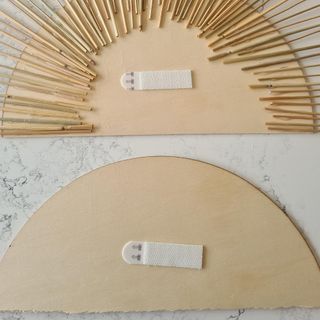 wheat sun with wooden disc and hanging strips