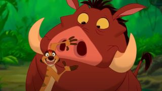 Timone standing in front of Pumbaa and covering his mouth in the Lion King.