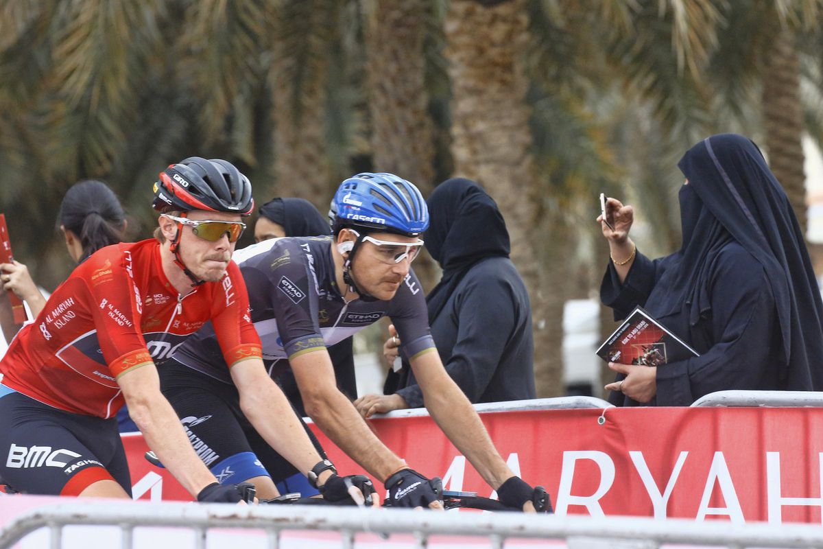 Rohan Dennis wears the leader's red jersey