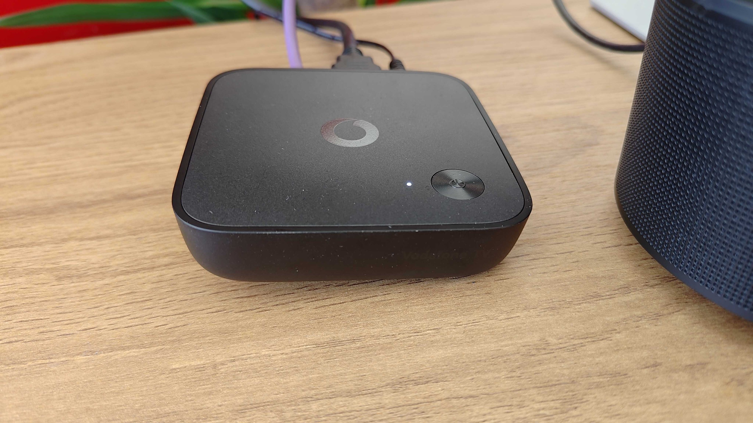 A picture of the Vodafone TV box plugged in on a desk