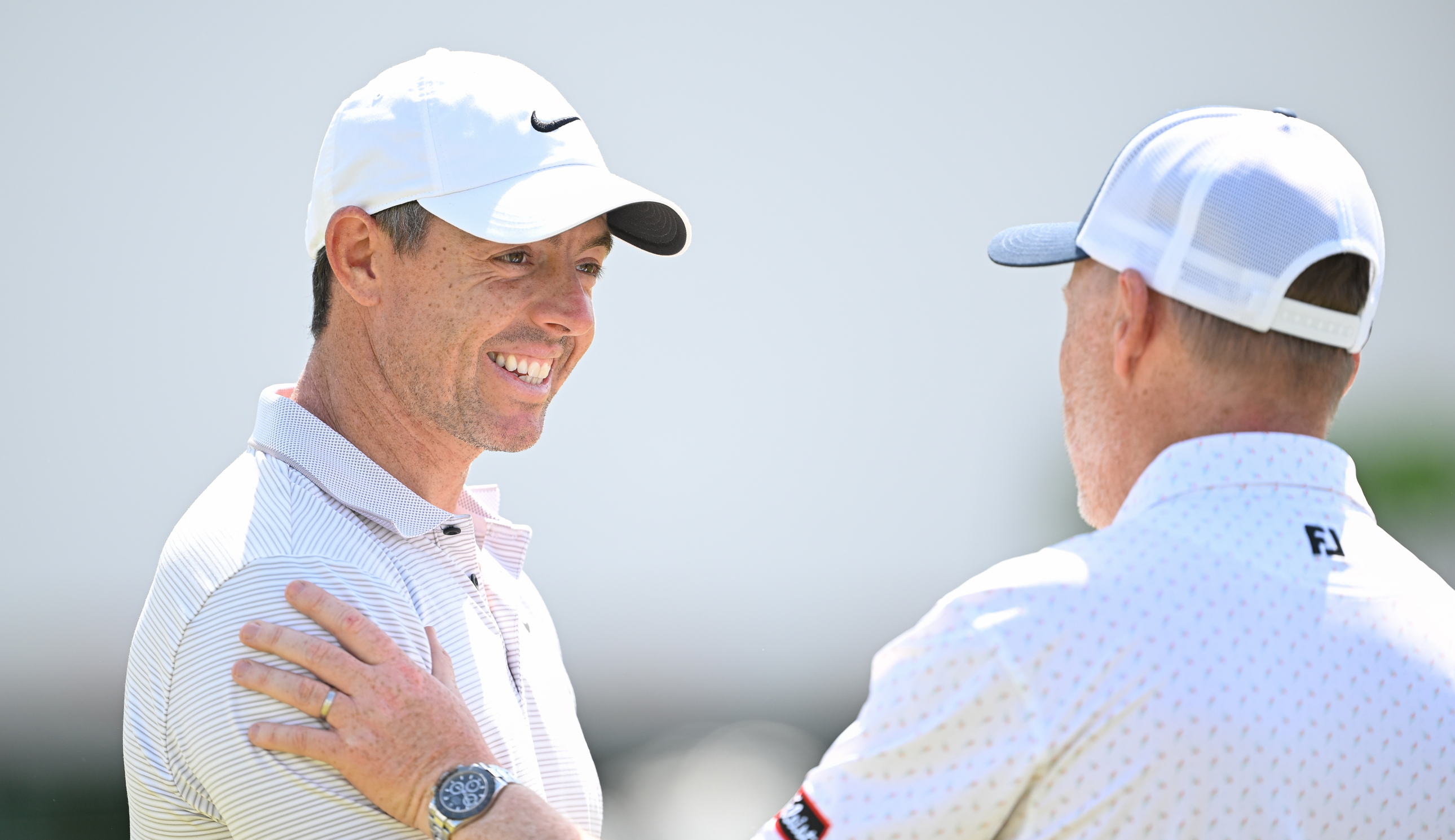 Rory McIlroy shakes hands
