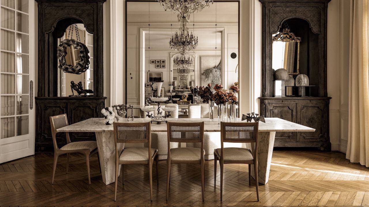 dining room with mirrored walls and parquet floors