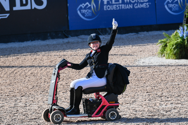 Natasha Baker exits the arena after a fall at WEG 2018