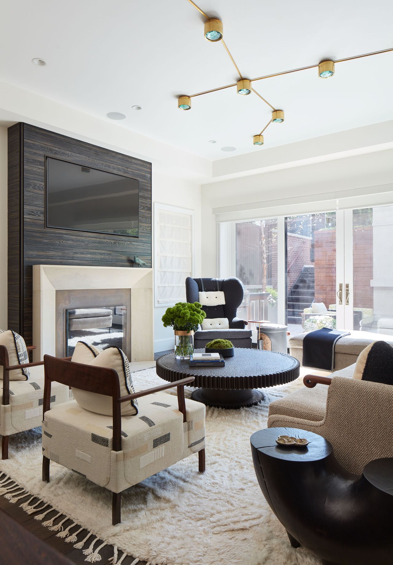 White fluffy rug, gold ceiling lamps