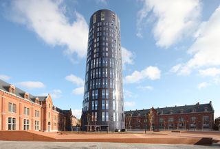 The smooth cylindrical form of the Police Headquarters & Charleroi Danses in Belgium by Ateliers Jean Nouvel & MDW Architecture creates a new urban landmark for Charleroi. Finalist in the European category, the mixed use building encourages diversity, combining the police headquarters with a dance company