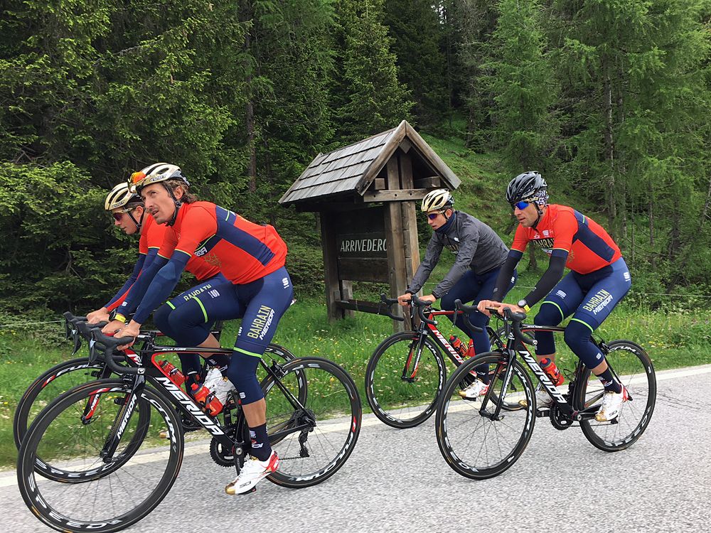 Pellizotti leads the line and looks up at the Dolomites