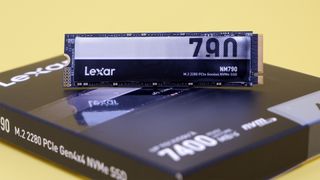 Lexar NM790 SSD on a yellow background with packaging.