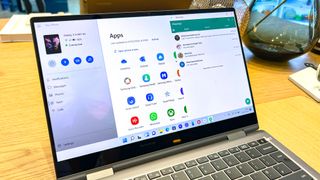 An image of a Samsung Galaxy Book 2 Pro 360 showing WhatsApp and the app menu open.