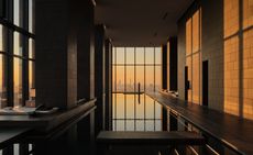 view of a serene hotel in tokyo, adorned with wooden furnishing, washi paper and natural stone touches