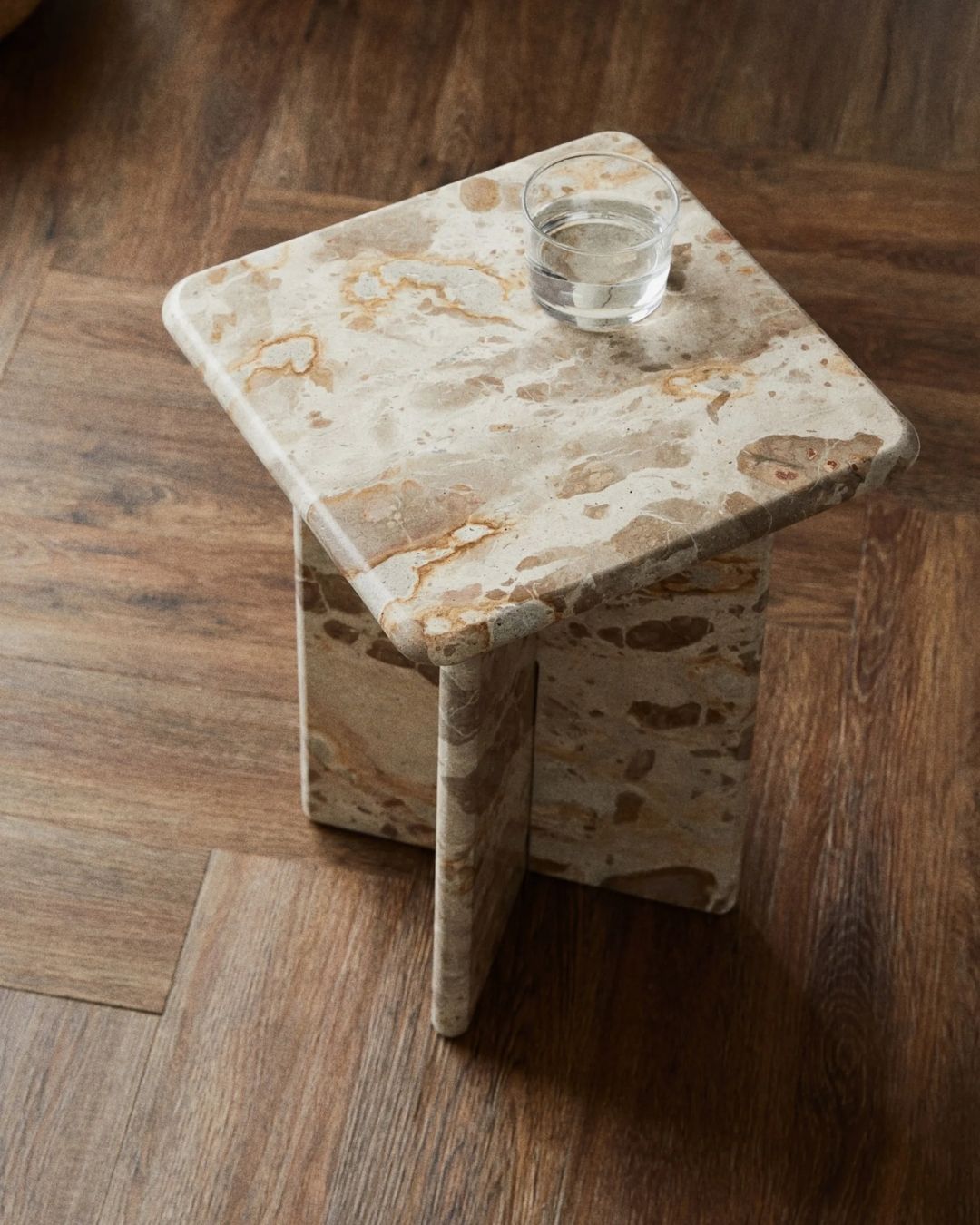 Marble Side Table against wooden table.