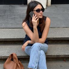 @borislavasekova wearing Mary Jane flats, stovepipe jeans, and black top 