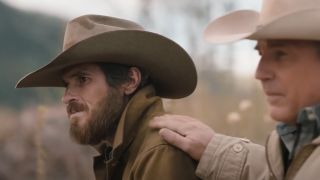 John putting his hand on Lee's shoulder in Yellowstone.