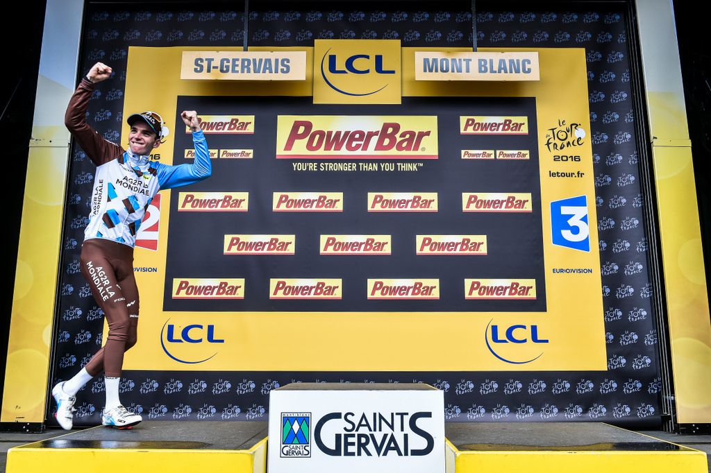 Roman Bardet (AG2r-La Mondiale) pumps the air as he walks onto the podium as stage winner