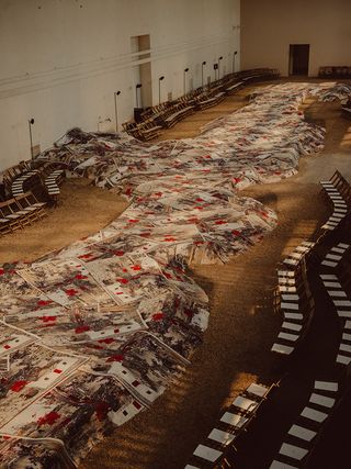 A rug-covered runway appeared to have risen up from the gravel at Paris’ Orangerie du Senat this season