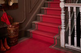 a staircase with a painted runner