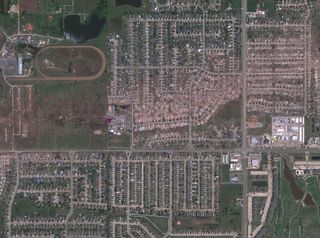 This satellite image taken on May 22 shows the exact path of the tornado as it tore through Moore, Okla.