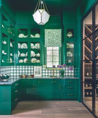 Green painted Shaker style kitchen