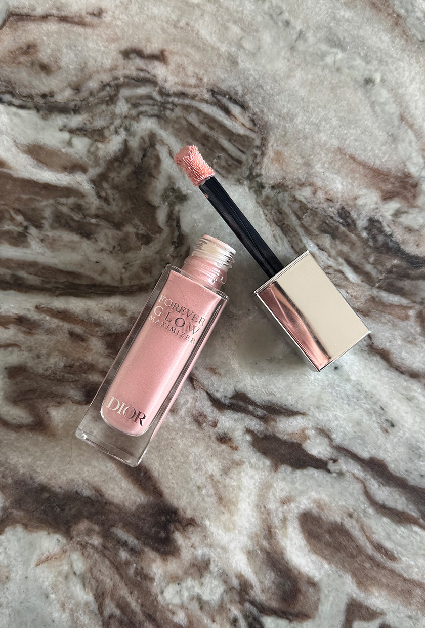 Pink Dior Beauty Glow Maximiser highlighter on marble table