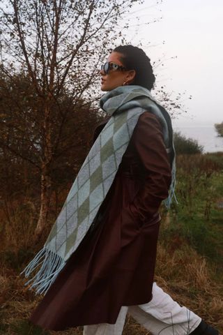 cold weather clothing - woman wearing blue and green checked scarf
