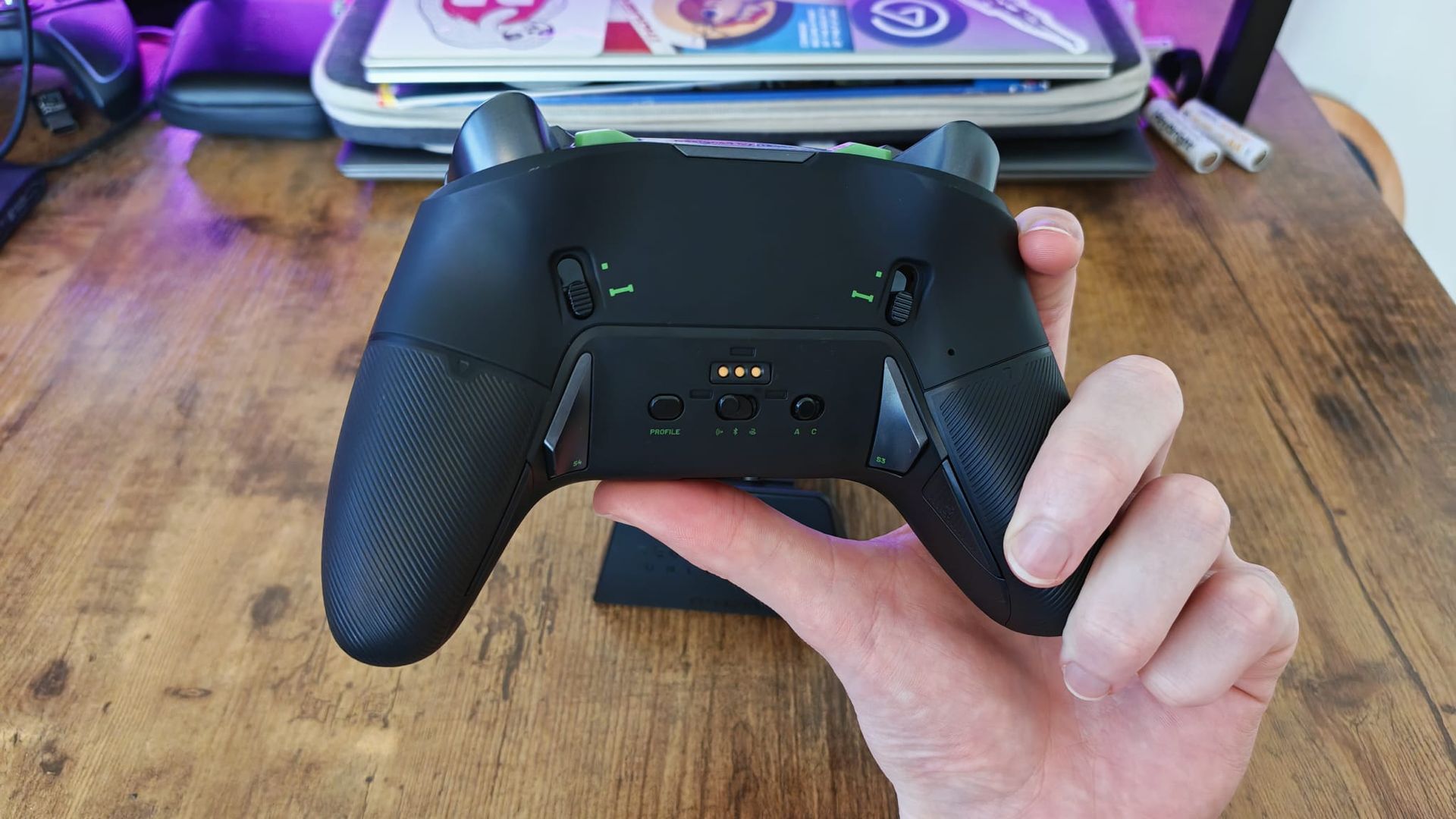 A reviewer showing the back of the Nacon Revolution X Unlimited