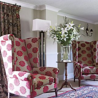 room with curtain and pink two armchairs