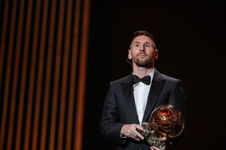 Inter Miami CF's Argentine forward Lionel Messi holds his trophy on stage as he receives his 8th Ballon d'Or award during the 2023 Ballon d'Or France Football award ceremony at the Theatre du Chatelet in Paris on October 30, 2023.