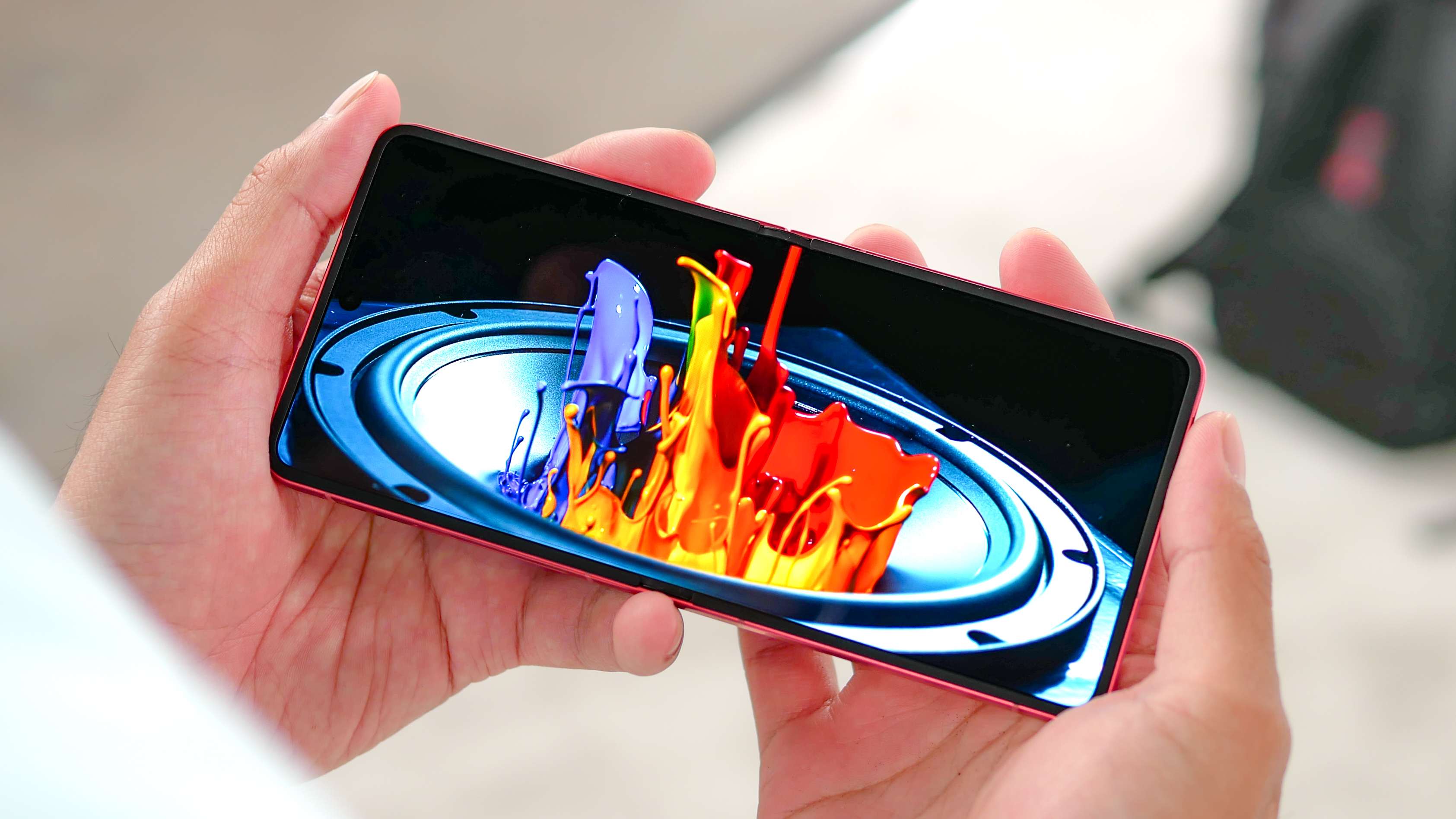 Samsung Galaxy Z Flip 7 playing a video on main screen.