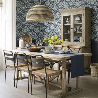 inky blue wallpapered dining room